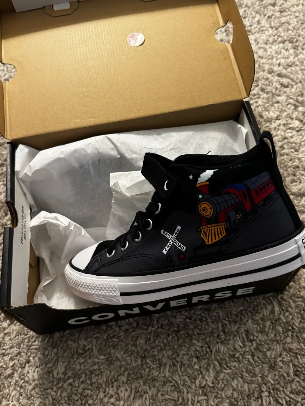 Converse Kids Black High-Top Sneakers with Multi-Color Train Graphic.